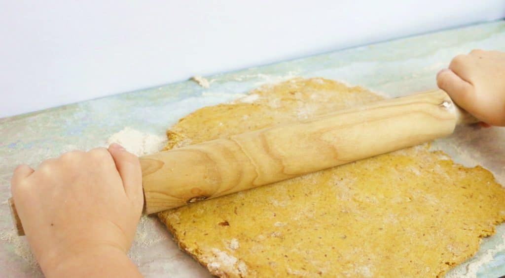rolling dough to make homemade dog treats
