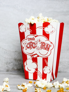 popcorn in a red and white popcorn box