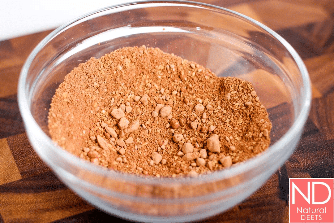 a bowl with a mix of almond flour, cocoa powder and flax seeds