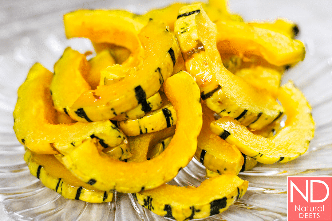 a picture of roasted delicata squash with yellw and green stripes