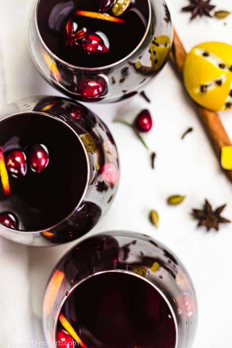 an overhead picture of dark red mulled wine in glasses