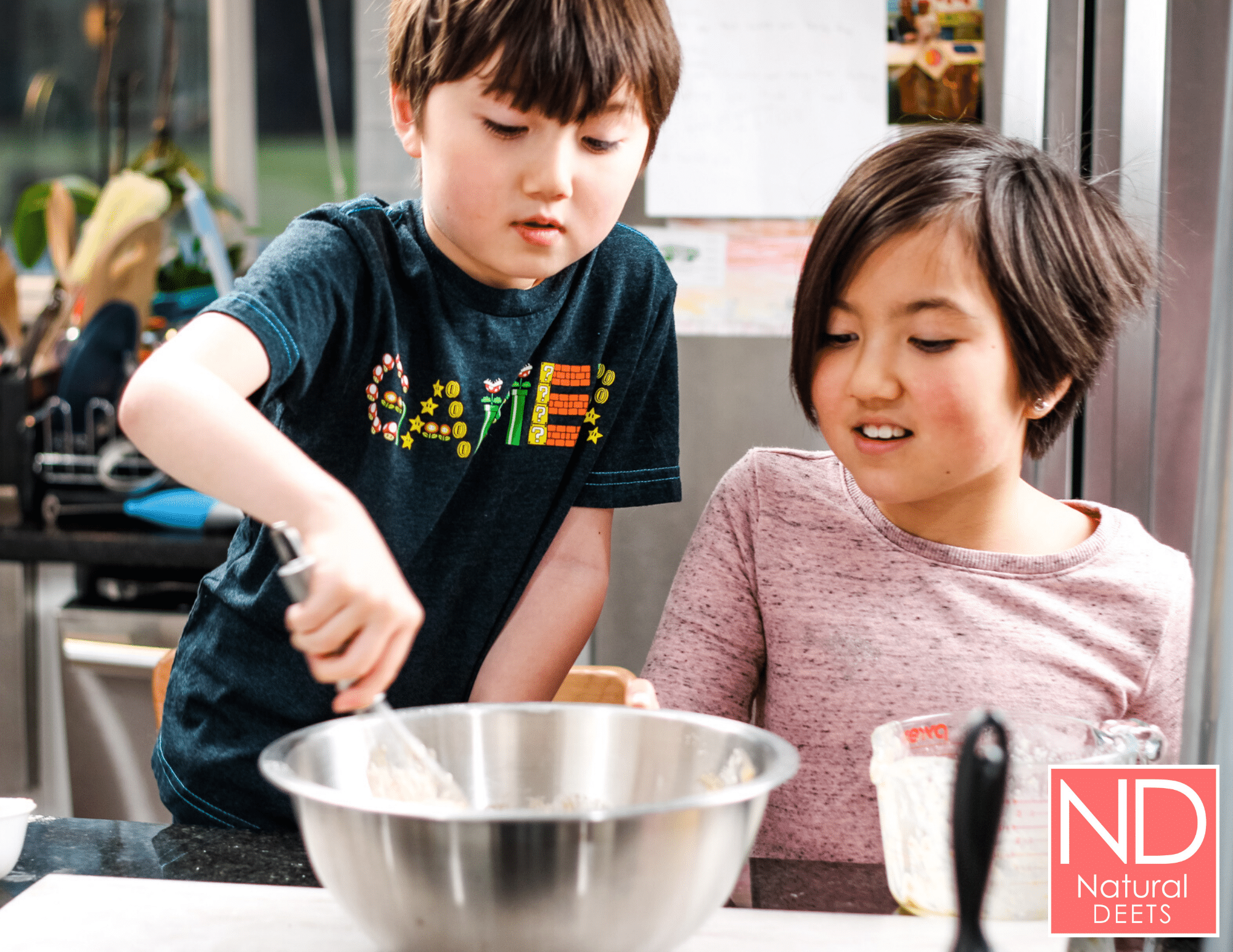 two kids mixing banana bread batter