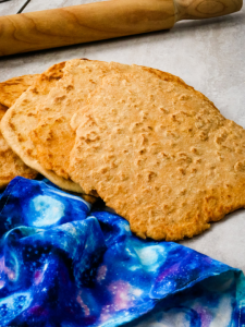 top view of a flatbread with a blue napkin