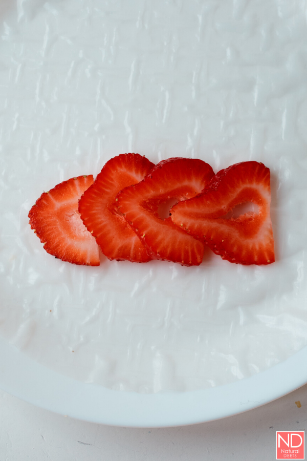 strawberry slices on a rice paper wrapper