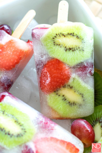 clear popsicles with kiwi and strawberry slices