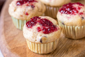 picture of three muffins with jelly on top