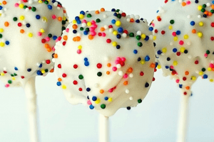 white round cake pops with sprinkles