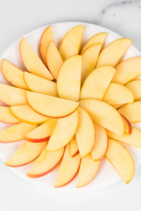 apple slices arranged on a place in a circular pattern
