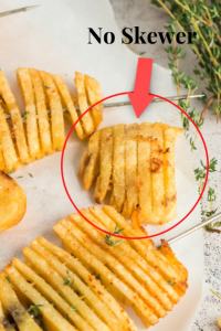 a picture of cooked potatoes with one circled that say no skewer. This was an accordion potato that did not have a skewerbut looks crispy like the others