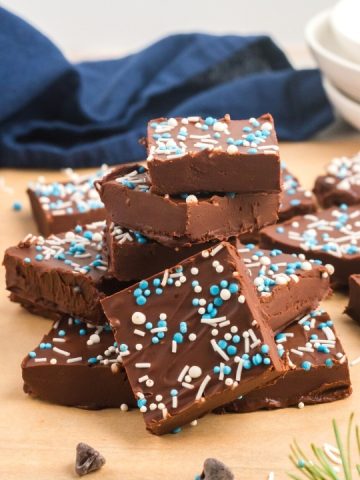 side view of a stack of fudge squares with white and blue sprinkles