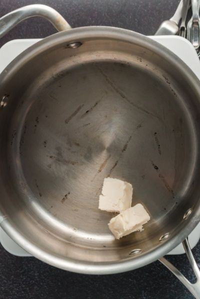 top view of a pot with two squares of butter