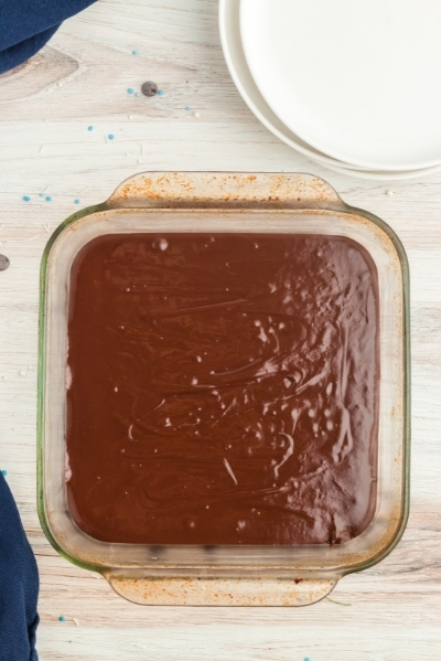 top view of a square glass pan with melted fudge