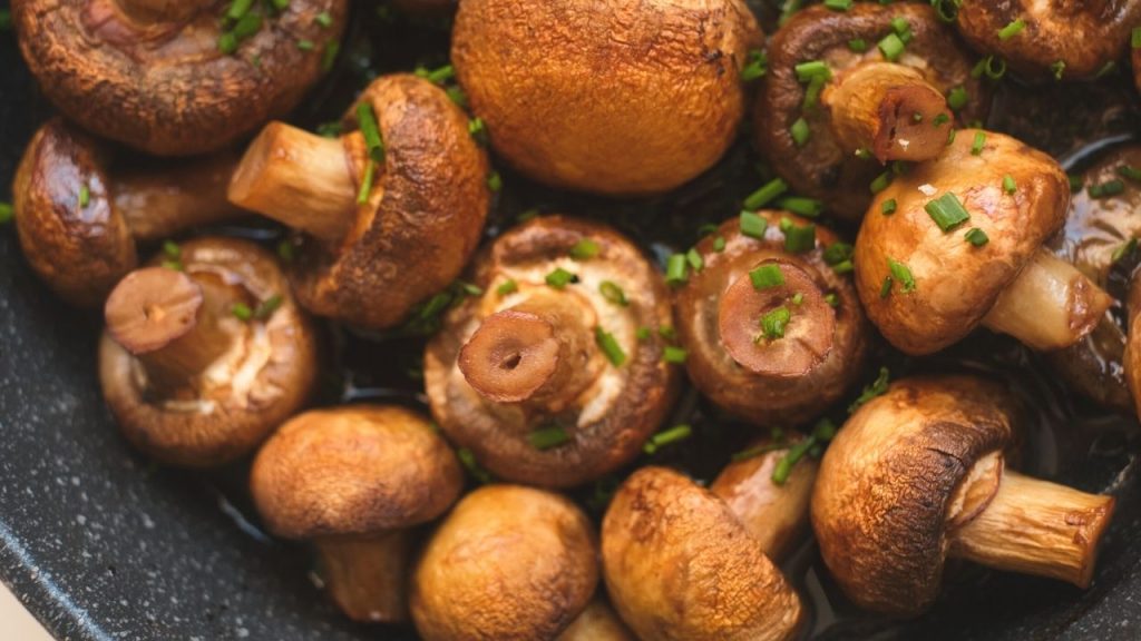 whole mushrooms in a pan