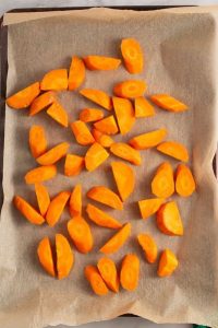top view of carrot slices on brown parchment paper