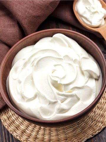 sour cream in a brown bowl