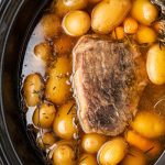cooked meat in the broth with potatoes