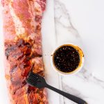 honey soy garlic ribs with marinade brushed on it