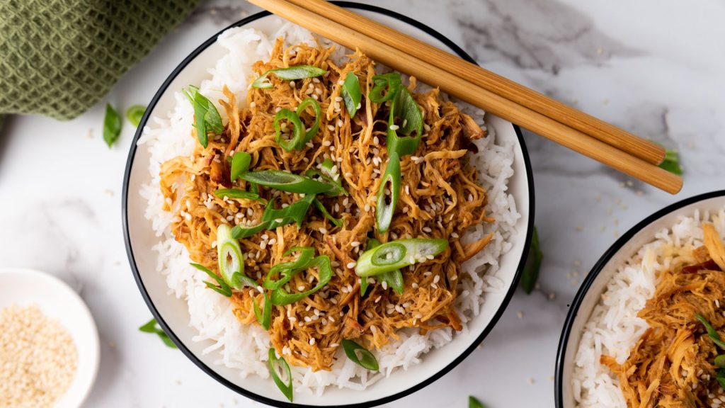 shredded chicken over rice